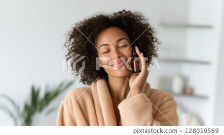 Beautiful woman practicing mindfulness and relaxation with eyes closed in cozy interior 128019569