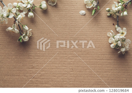 White Blossoms on Cardboard Background for Nature and Design Concepts 128019684