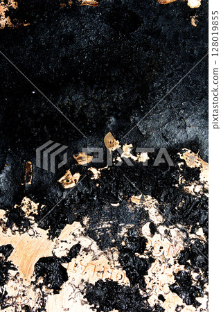 Close up of heavy black rust on a brass base of a kitchen sauce pan abstract background 128019855