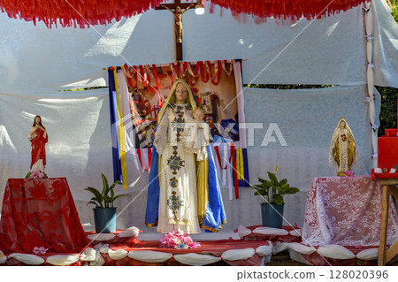 Altar decorated with images of saints Altar decorated with images of saints 128020396