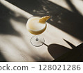 Creamy pina colada cocktail with pineapple on neutral stone background, top view. 128021286