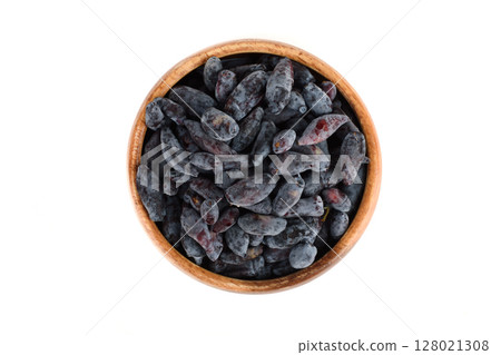 Top view of ripe honeysuckle berries in wooden bowl on white background. Top view of ripe honeysuckle berries in wooden bowl on white background. 128021308