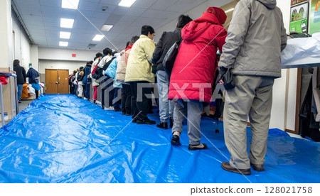 Elderly people receiving relief supplies Elderly people receiving relief supplies 128021758