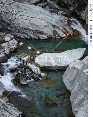 Turquoise water surging through rocky gorge in aosta, revealing dramatic alpine landscape under crisp november light pontboset Turquoise water surging through rocky gorge in aosta, revealing dramatic alpine landscape under crisp november light pontboset 128021957