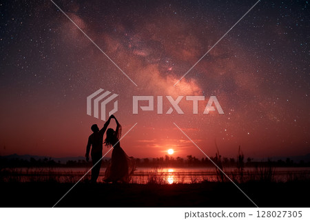 Silhouette of a couple dancing under the stars Silhouette of a couple dancing under the stars 128027305