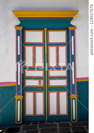 Beautiful facades of the colonial houses at the streets of the Heritage Town of Jerico located in the Department of Antioquia in Colombia. Beautiful facades of the colonial houses at the streets of the Heritage Town of Jerico located in the Department of Antioquia in Colombia. 128027676