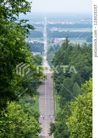 A straight road to the sky in Hokkaido, Japan 128028107