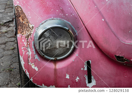 Weathered surface texture of a vintage automobile headlight and fender Weathered surface texture of a vintage automobile headlight and fender 128029138