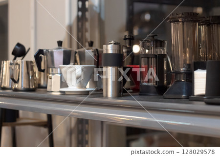 Close-up of manual coffee brewing setup with dripper and Moka pots Close-up of manual coffee brewing setup with dripper and Moka pots 128029578