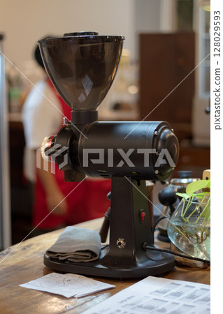 Professional electric coffee grinder machine used for brewing fresh coffee in a cafe at Mataram, Indonesia on November 10, 2024 Professional electric coffee grinder machine used for brewing fresh coffee in a cafe at Mataram, Indonesia on November 10, 2024 128029593