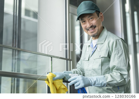 Building cleaning image Senior cleaning staff smiling at the camera 128030166