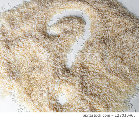 A pile of dry white rice with a question mark drawn on it 128030463