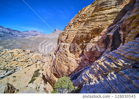 Rugged Red Rock Canyon Layers with Desert Mountains Aerial Perspective 128030543