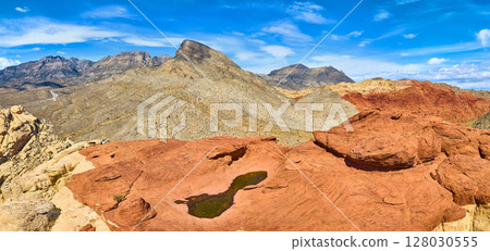Aerial of Red Rock Canyon Sandstone Formations and Turtlehead Peak 128030555