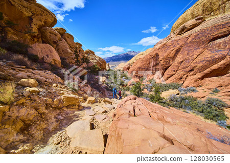 Hikers Traverse Red Rock Canyon Sandstone Cliffs Aerial 128030565