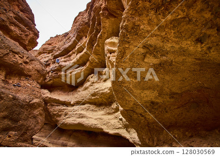 Rugged Red Rock Formations Towering View in Owl Canyon Rugged Red Rock Formations Towering View in Owl Canyon 128030569