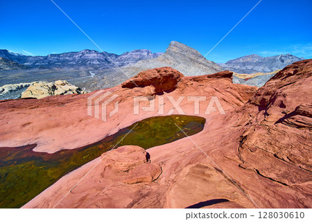 Red Rock Canyon Sandstone Formations with Reflective Pool Aerial 128030610