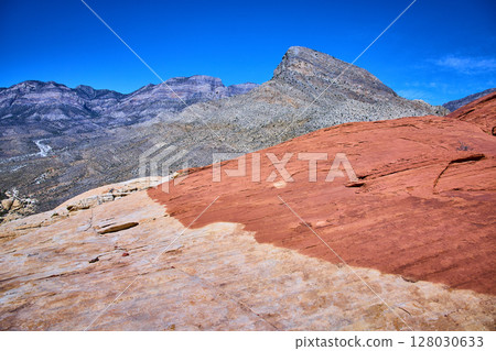 Red Rock Canyon Sandstone and Mountains with Expansive Desert View 128030633