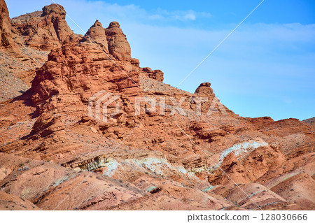 Rugged Red Rock Formations Against Blue Sky Nevada Eye-Level View 128030666