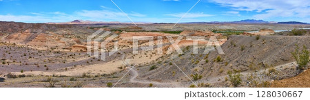 Desert Panorama with Rugged Hills and Path Boulder City Eye-Level View Desert Panorama with Rugged Hills and Path Boulder City Eye-Level View 128030667