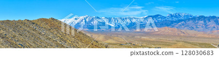 Aerial of Snow-Capped Mt Charleston and Desert Hills 128030683