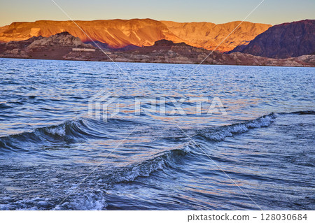 Golden Mountains and Rippling Lake at Sunset Perspective 128030684