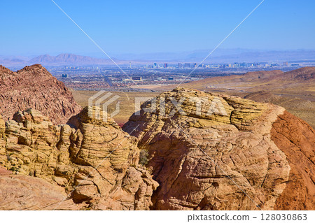 Red Rock Canyon and Las Vegas Skyline Contrast from Eye-Level Perspective 128030863