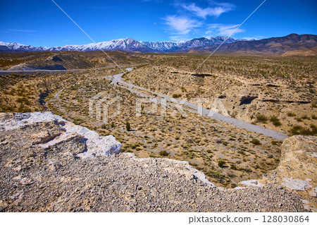 Desert and Snow-Capped Mountains Panorama with Dry Riverbed Motion Desert and Snow-Capped Mountains Panorama with Dry Riverbed Motion 128030864