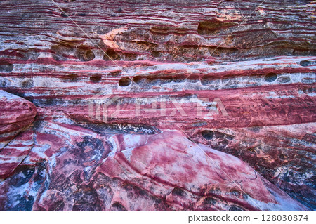 Vivid Red Rock Textures and Erosion Patterns Close Up Vivid Red Rock Textures and Erosion Patterns Close Up 128030874