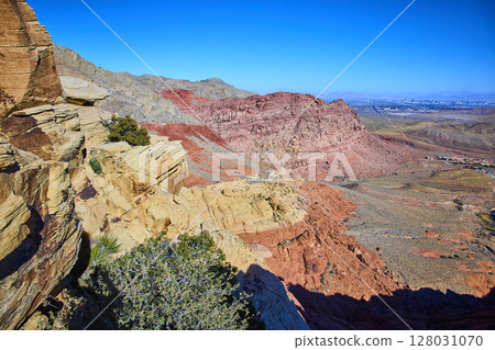 Red Rock Canyon Desert Landscape with Las Vegas Skyline in Background Red Rock Canyon Desert Landscape with Las Vegas Skyline in Background 128031070