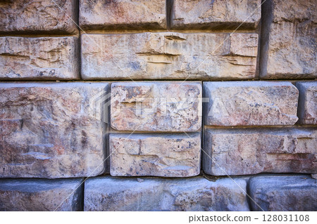Rustic Stone Wall Texture Close-Up in Soft Daylight 128031108