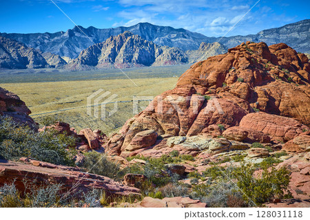 Red Rock Canyon Sandstone Layers and Mountains Aerial 128031118