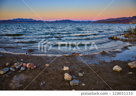 Sunset Over Lake Mead with Mountain Silhouettes at Eye Level Sunset Over Lake Mead with Mountain Silhouettes at Eye Level 128031133