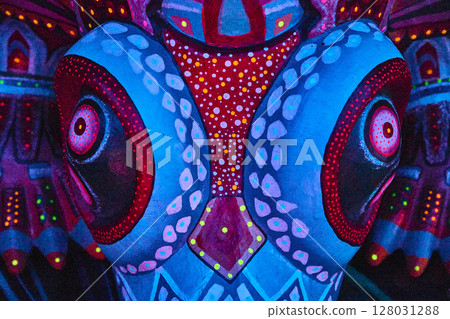 Vibrant Mexican Mask Art with Motion Patterns at Eye Level Vibrant Mexican Mask Art with Motion Patterns at Eye Level 128031288