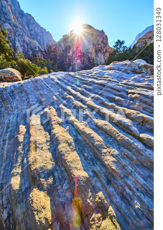 Sunburst Over Striated Rocks in Ice Box Canyon Low Angle Perspective 128031349