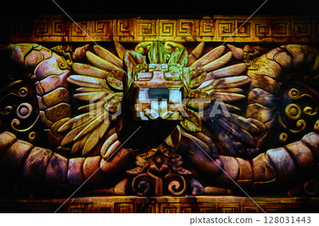 Ancient Aztec Stone Carving with Mythical Face Eye-Level Perspective Ancient Aztec Stone Carving with Mythical Face Eye-Level Perspective 128031443