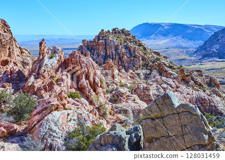 Red Rock Canyon Rugged Terrain and Blue Sky Eye-Level View Red Rock Canyon Rugged Terrain and Blue Sky Eye-Level View 128031459