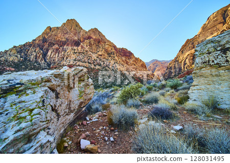 Red Rock Canyon Desert Landscape with Rugged Mountains at Golden Hour Red Rock Canyon Desert Landscape with Rugged Mountains at Golden Hour 128031495