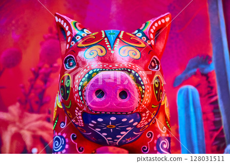 Vibrant Mexican Folk Art Pig Close-Up with Desert Motifs 128031511