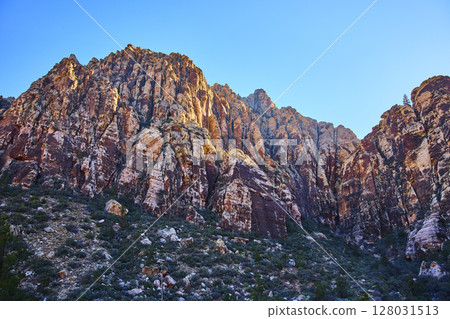 Rugged Red Rock Formations at Golden Hour Eye-Level Perspective Rugged Red Rock Formations at Golden Hour Eye-Level Perspective 128031513