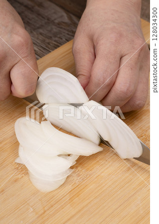 Steps for making vegetable consommé soup: Chop and simmer vegetables, cut onions Steps for making vegetable consommé soup: Chop and simmer vegetables, cut onions 128034300