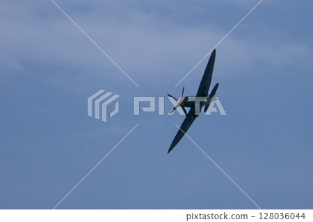 Spitfire plane in flight on sunny day. High quality photo Spitfire plane in flight on sunny day. High quality photo 128036044