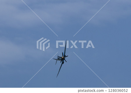 Spitfire plane in flight on sunny day. High quality photo Spitfire plane in flight on sunny day. High quality photo 128036052