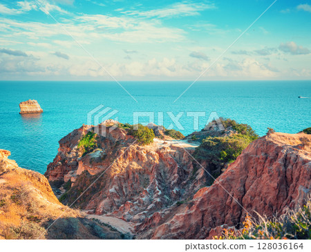 Rocky seascape in the Algarve region in the Atlantic Ocean, Lagoa, Portugal, Europe Rocky seascape in the Algarve region in the Atlantic Ocean, Lagoa, Portugal, Europe 128036164