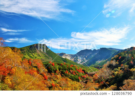 Hokkaido Tokachidake of autumn blue sky and colored leaves Hokkaido Tokachidake of autumn blue sky and colored leaves 128036790