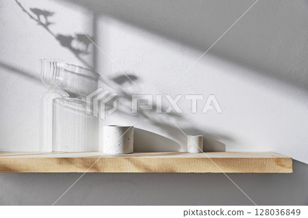 Concrete texture background with shadows from natural light streaming through a window. 128036849