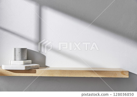 Concrete texture background with shadows from natural light streaming through a window. 128036850