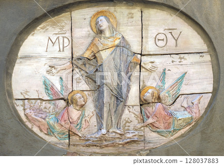 Virgin Mary relief on the facade in Lucca, Tuscany, Italy Virgin Mary relief on the facade in Lucca, Tuscany, Italy 128037883