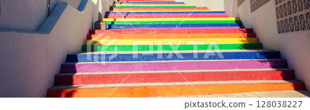 Colorful staircase in the park. The steps are painted in rainbow colors. Nerja, Malaga, Spain. Horizontal banner 128038227