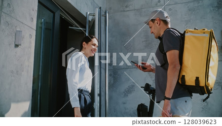 Delivery Man on E-Scooter Brining Brown Paper Bag with Online Shopping Order for Businesswoman Delivery Man on E-Scooter Brining Brown Paper Bag with Online Shopping Order for Businesswoman 128039623